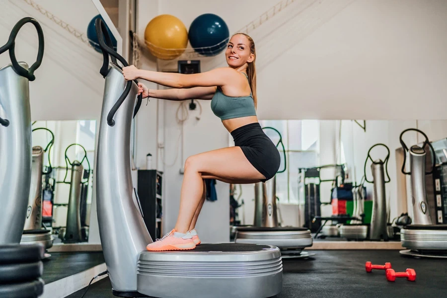 A woman on a vibration power plate