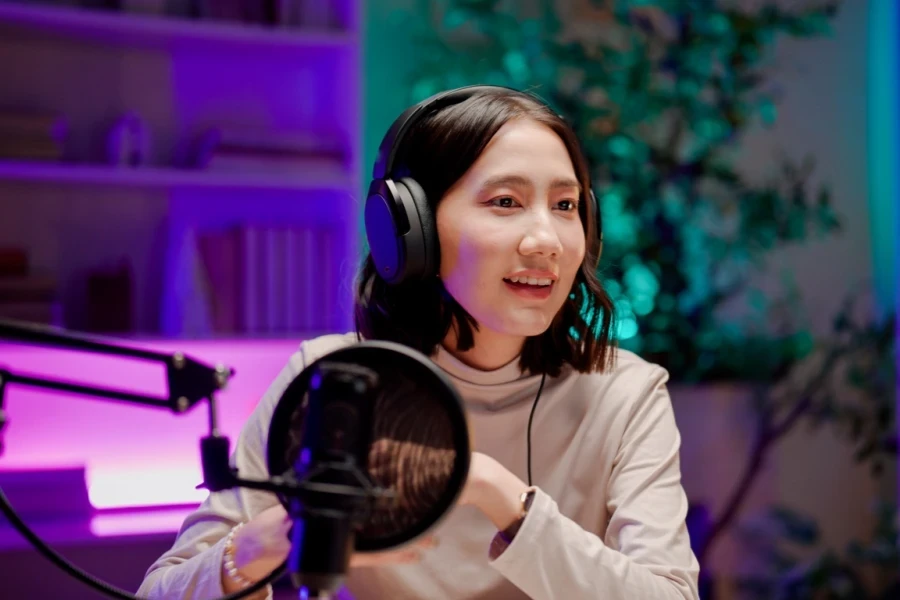 A young Asian woman running a podcast