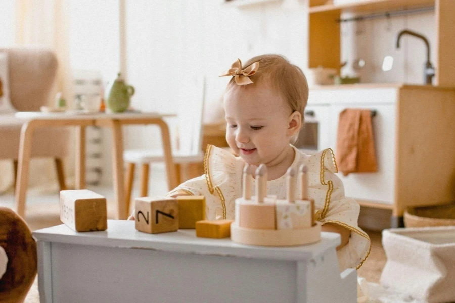 Adorable Baby Playing with Wooden Blocks Indoors