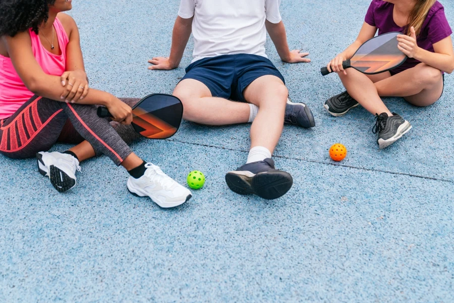 Athletes resting after a game of pickleball
