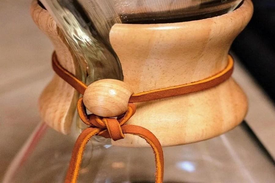 Bamboo and glass coffee carafe on table in coffee shop