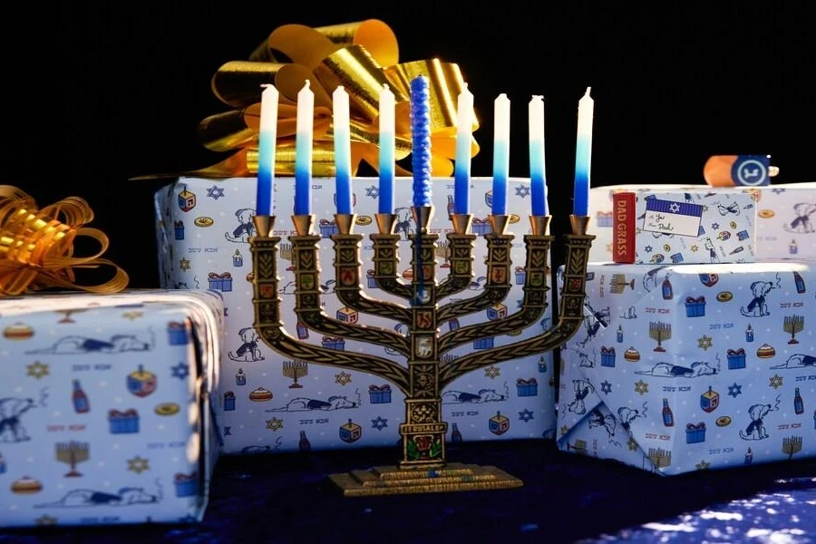 Blue and white menorah candles on Hanukkah menorah