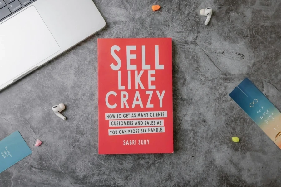 Book titled ‘Sell Like Crazy’ on a gray table