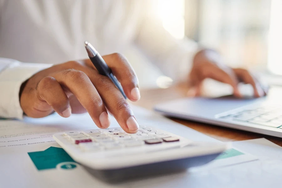 Businessman calculating marginal revenue in his office