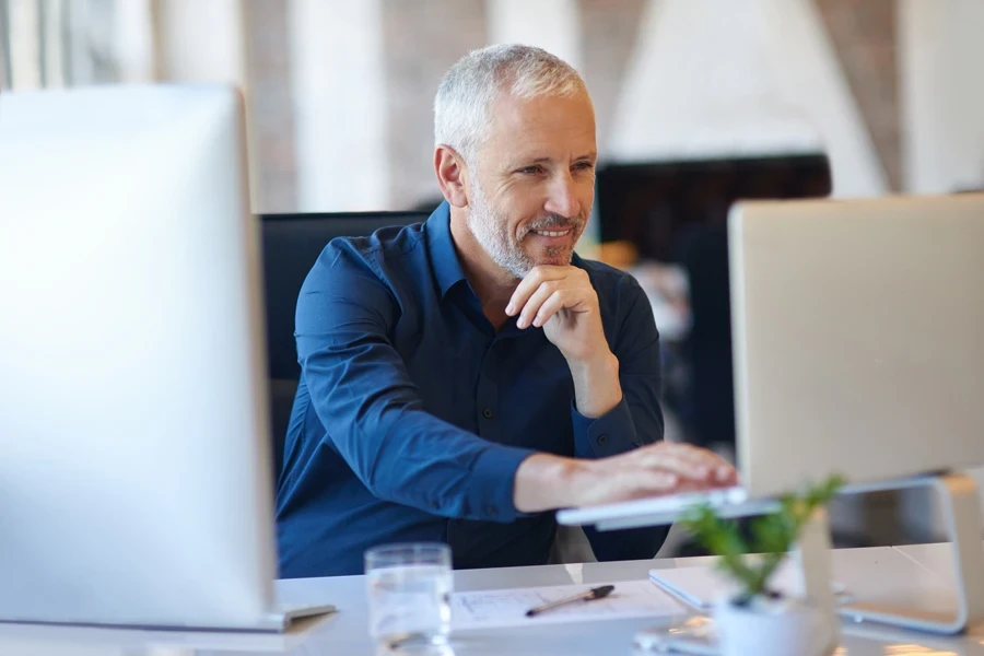 Businessman reading an email on his laptop