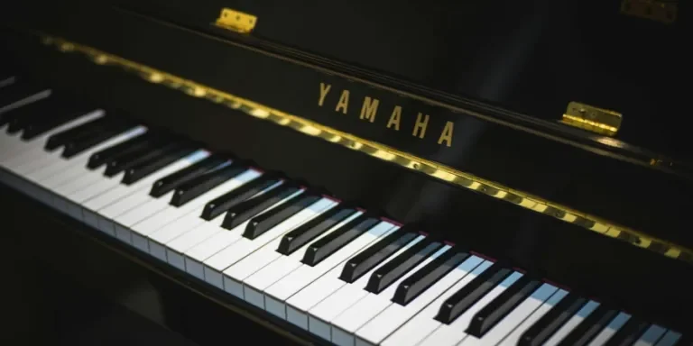 Close-up of a Yamaha piano showing black and white keys, perfect for music enthusiasts