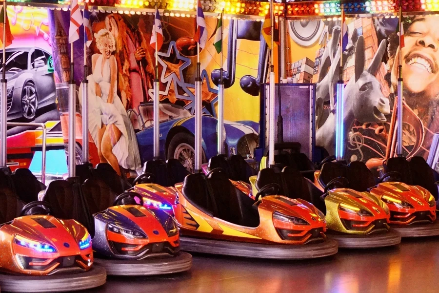 Colorful bumper cars at a lively carnival setting in Goslar, Germany