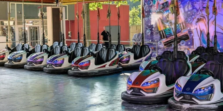Colorful bumper cars lined up at an outdoor funfair in Werlte, Deutschland