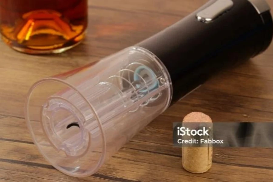 Cordless wine bottle opener on wooden table