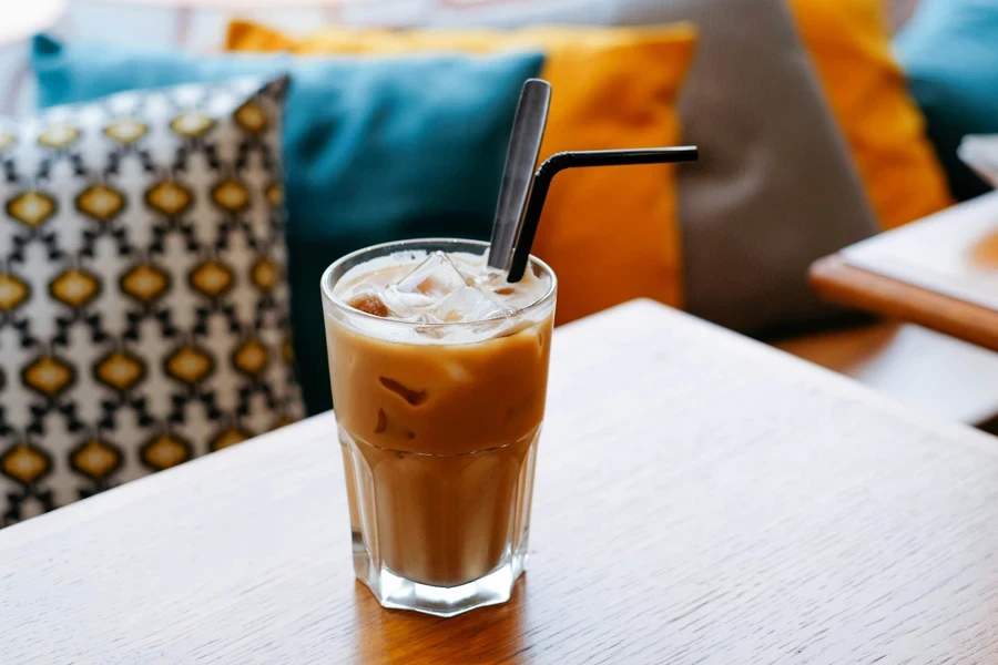 Cup of latte with straw