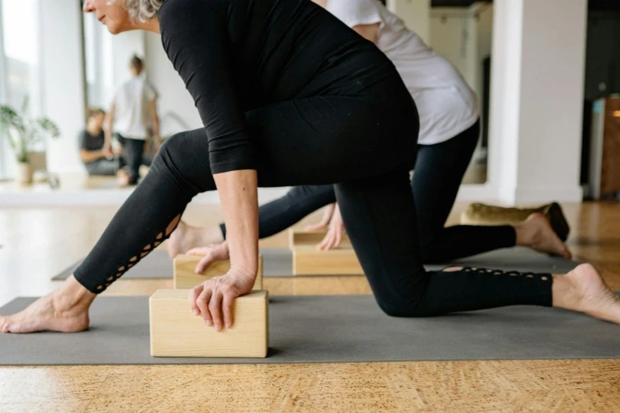 Elderly Women Exercising at Yoga Classes