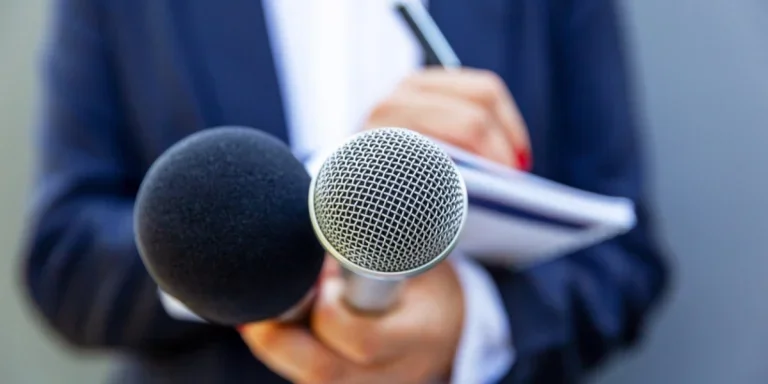 Female journalist asking questions at a press conference