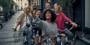 Friends riding bicycles in a city