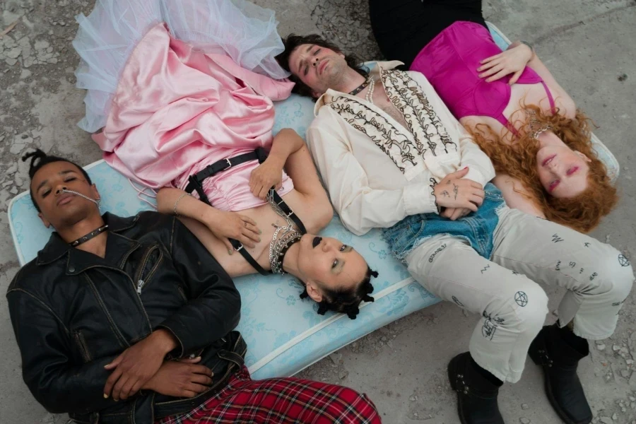 Group of People Lying on Blue Mattress