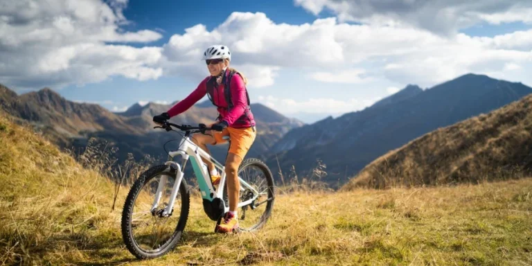 Happy Woman on Mountain Hybrid Bike