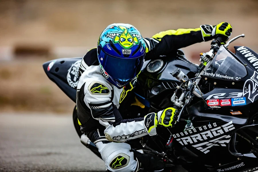 High-speed motorcycle racing on a track, showcasing a rider leaning into a turn