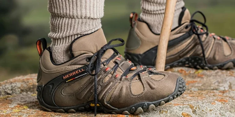 Hiking boots by Merrell on a rock edge, featuring outdoor adventure gear