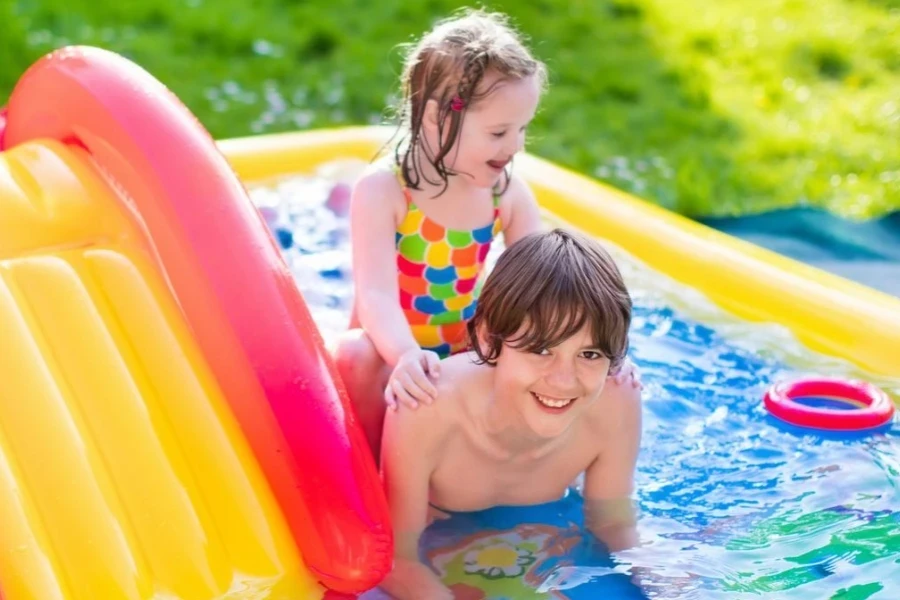 Kids Playing in an Inflatable Pool