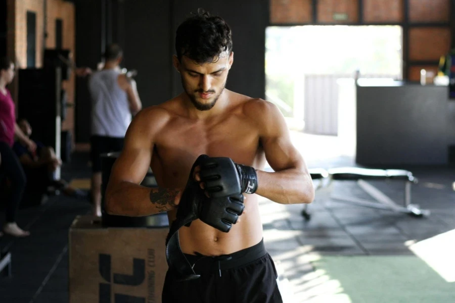 Man Standing Wearing Black Leather Gloves