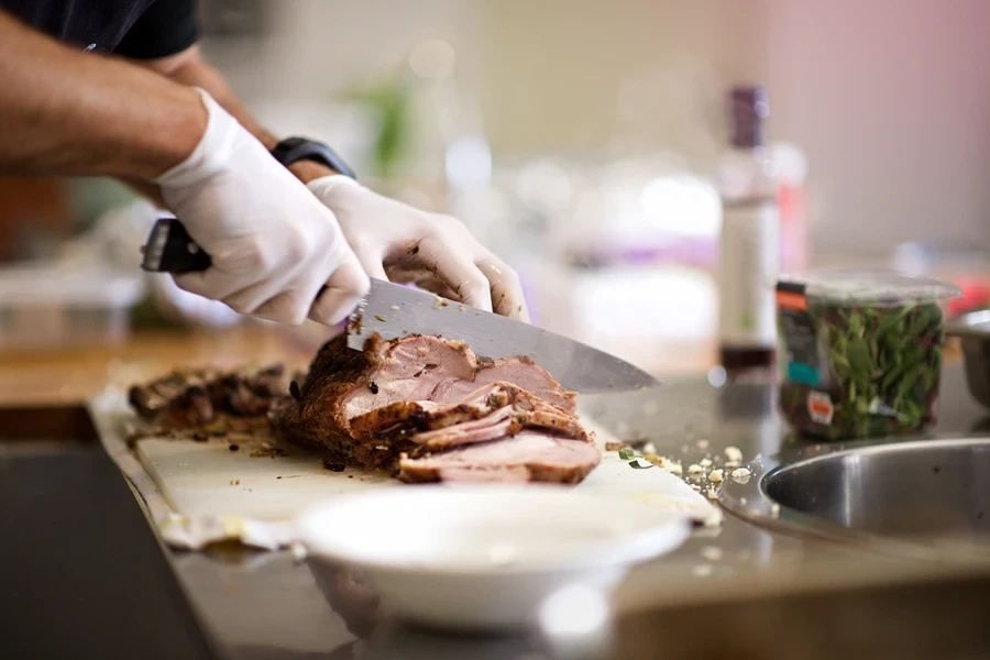 Man cutting meat easily with a sharp knife