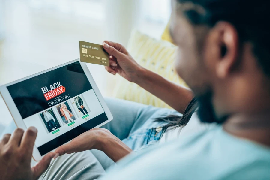 Man happily snagging black Friday deal