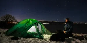 Man near Tent on Winter Camping in Fjords