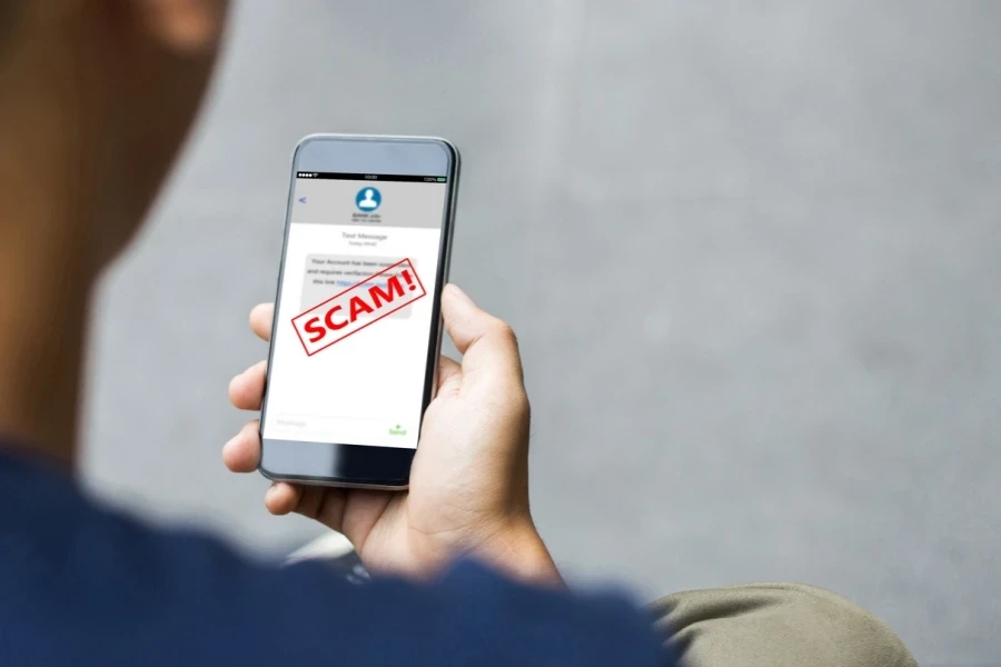 Man reading a scam message