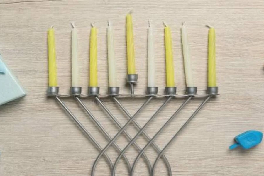 Nine beeswax candles on First Night of Hanukkah