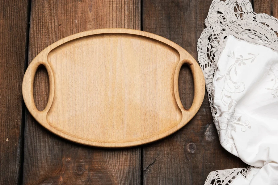 Oval brown wooden tray with handle
