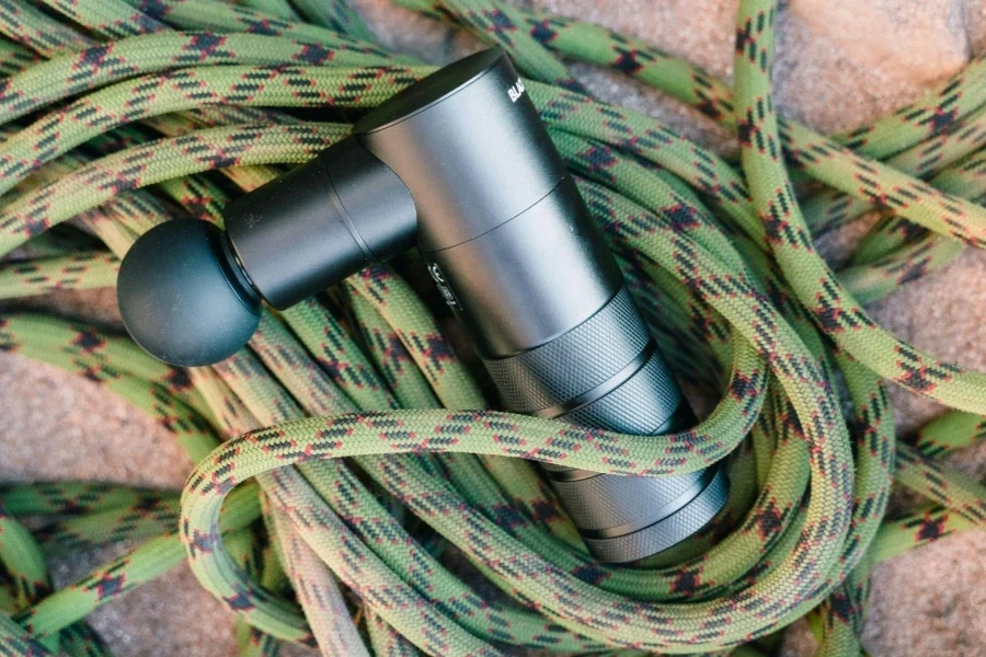 Overhead Shot of a Massage Gun and Rope