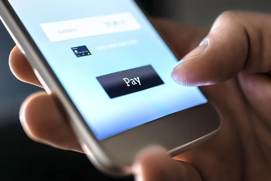 Person completing a mobile payment with digital wallet