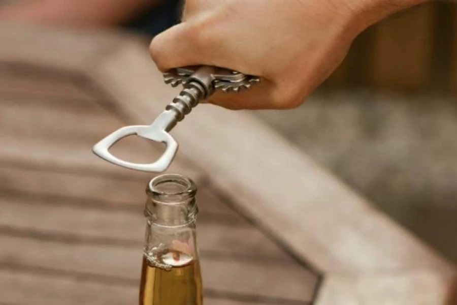 Person using a corkscrew opener