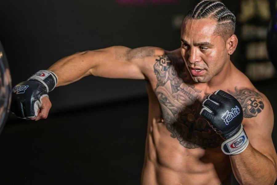 Photo of a Man Training with Punching Bag