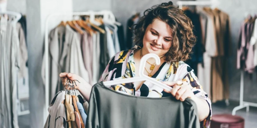 Plus Size Woman Choose Fashioned Dress in Store