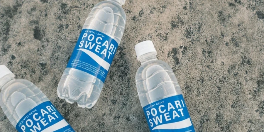 Pocari Sweat Bottles on Concrete Surface