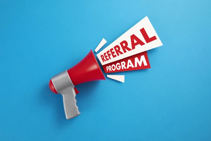 Red megaphone with referral program announcement