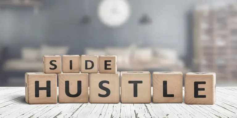 Side Hustle spelled out in Scrabble tiles
