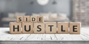 Side hustle written on word blocks