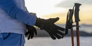 Skier About To Pick Up Her Ski Poles