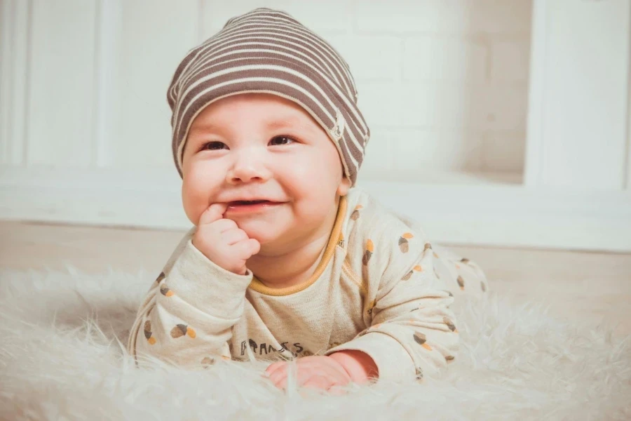 Smiling Baby Biting Right Index Finger