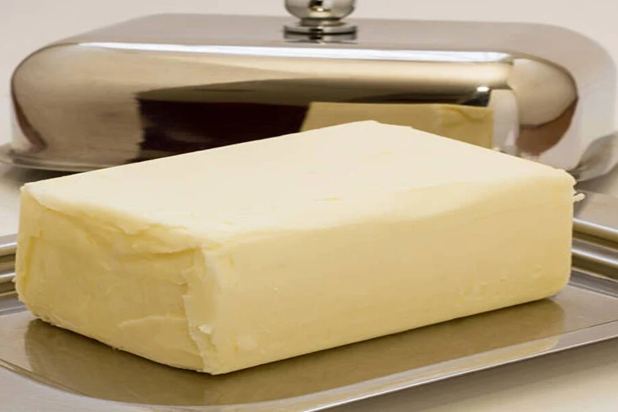 Stainless steel butter dish with curved lid removed