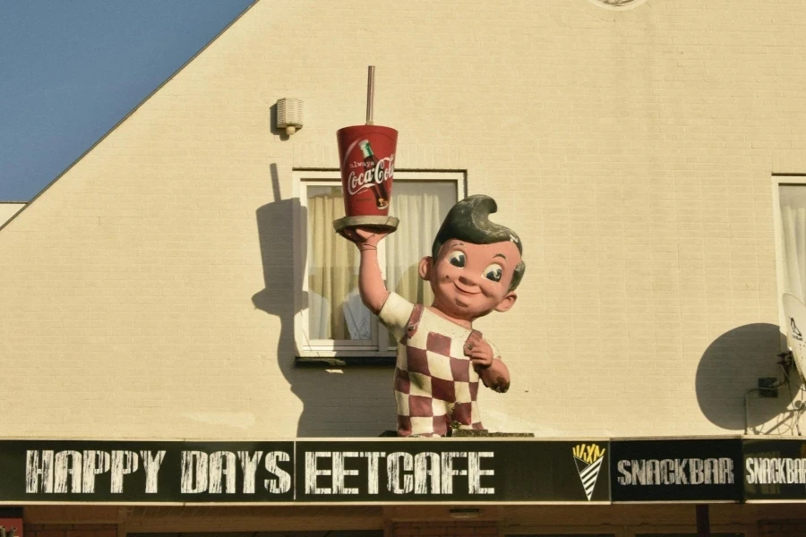 Statue Above a Signage