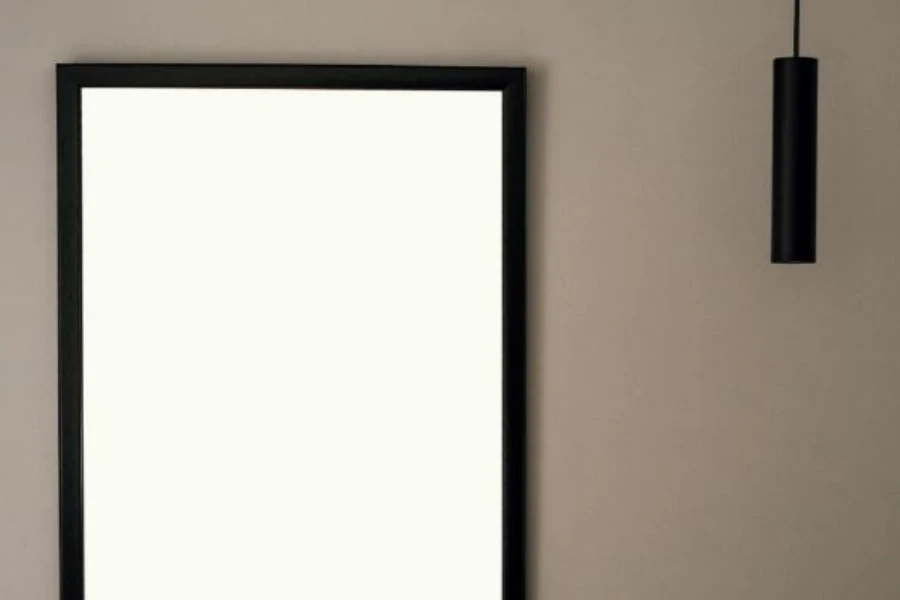 Wall with blank black picture frame