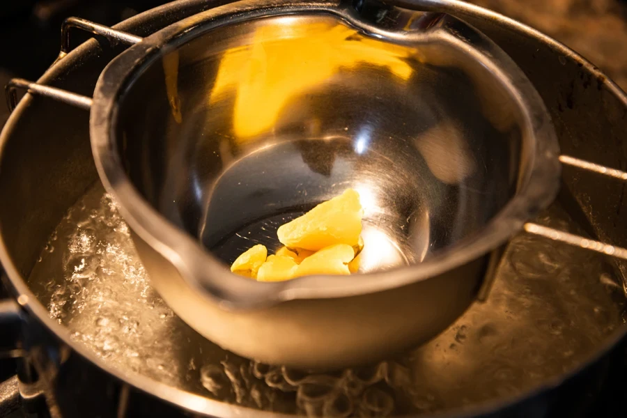 Wax melting in a double boiler over boiling water