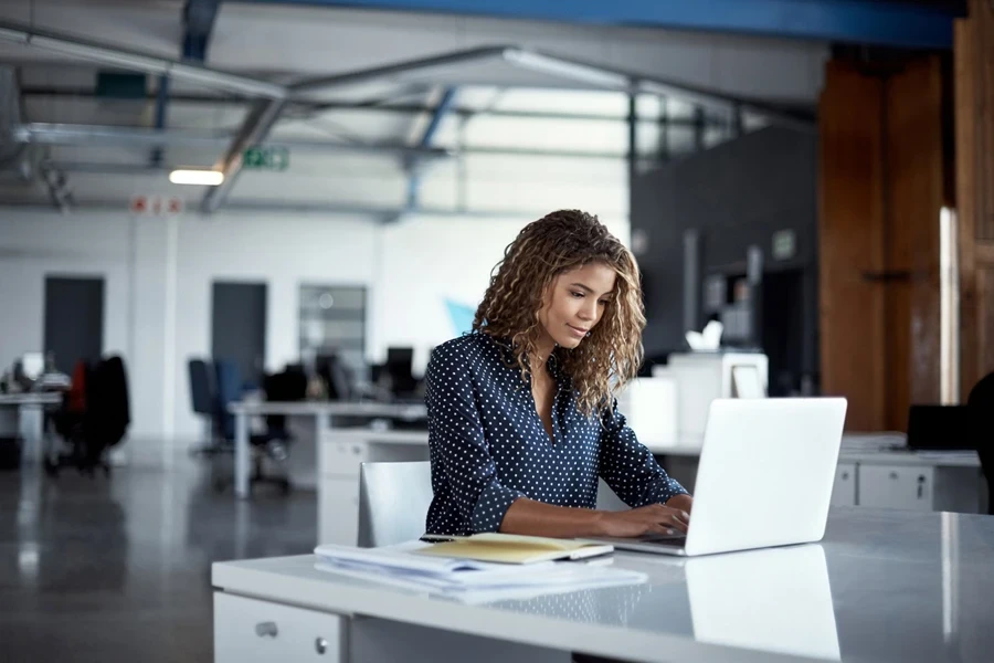 Woman creating something on her laptop