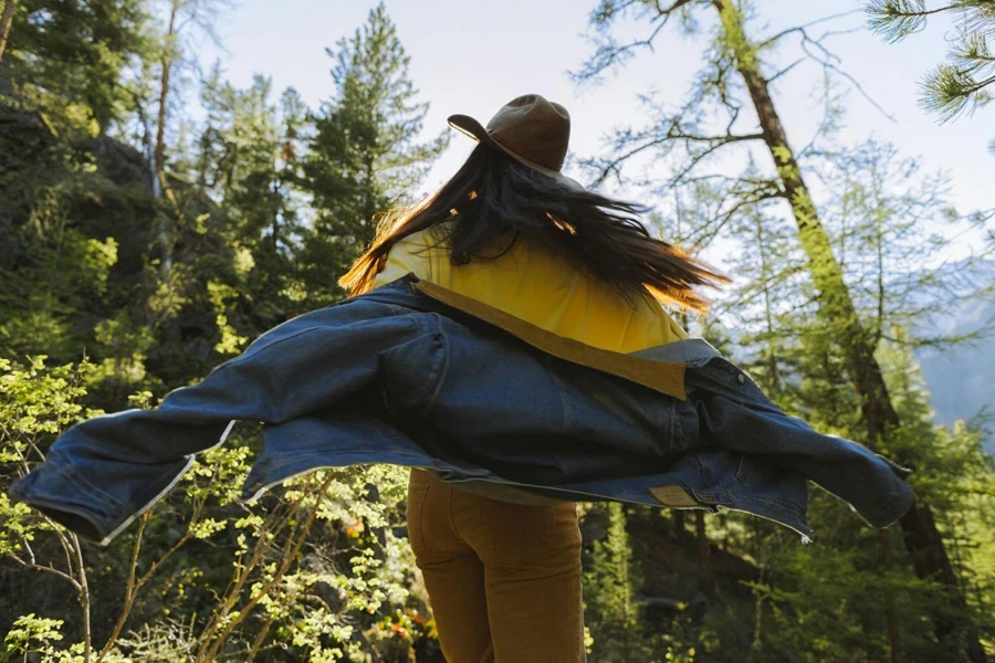Woman in Yellow Shirt and Blue Denim Jacket