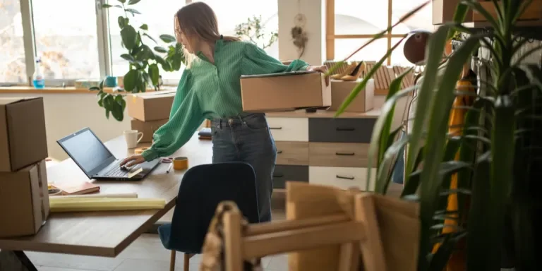 Woman packaging online orders from her store