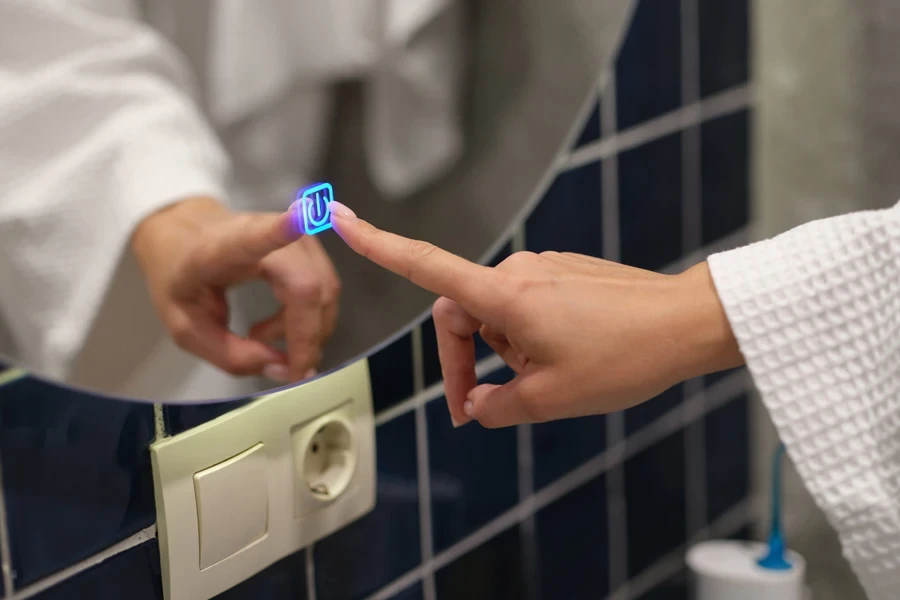 Woman pressing a digital button on a mirror
