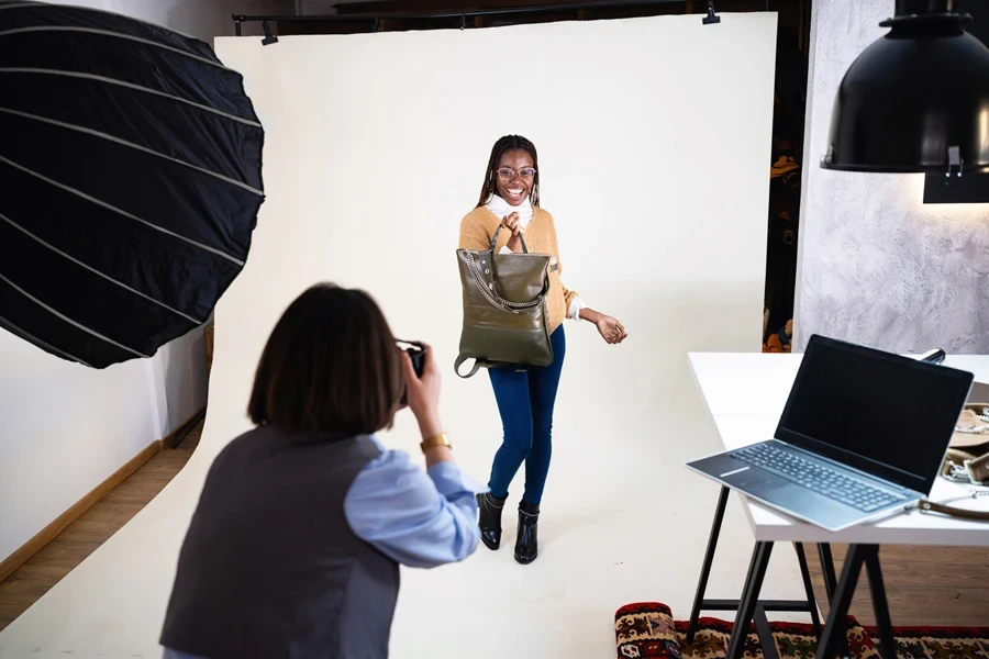 Woman taking a lifestyle photo in a studio