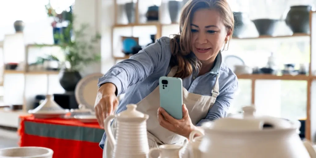Woman taking a picture of her products